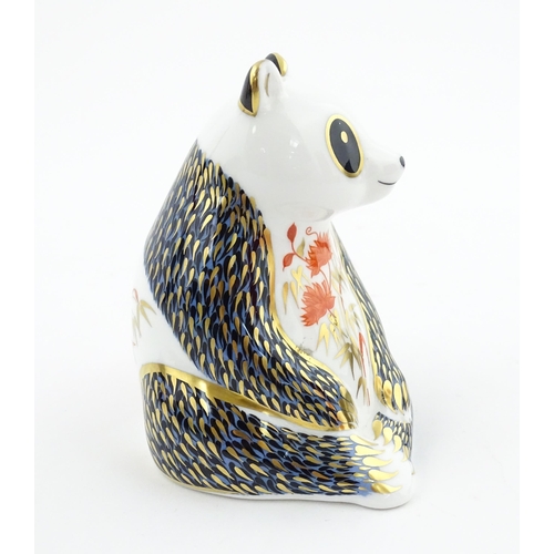 115 - A Royal Crown Derby paperweight modelled as a seated Panda. Boxed. Approx. 4 1/4