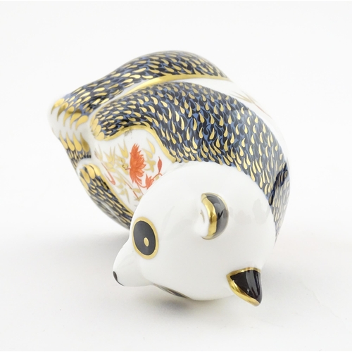 115 - A Royal Crown Derby paperweight modelled as a seated Panda. Boxed. Approx. 4 1/4