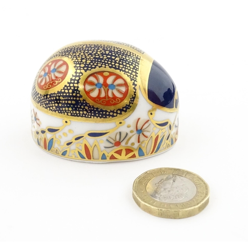 117 - A Royal Crown Derby paperweight modelled as a Blue Ladybird. Boxed. Approx. 1 1/2