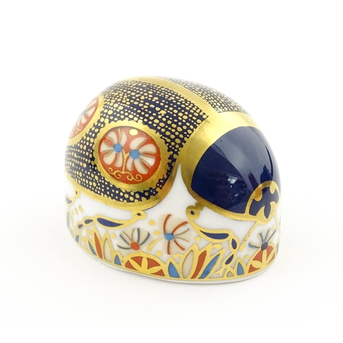 117 - A Royal Crown Derby paperweight modelled as a Blue Ladybird. Boxed. Approx. 1 1/2