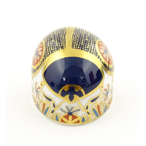 117 - A Royal Crown Derby paperweight modelled as a Blue Ladybird. Boxed. Approx. 1 1/2