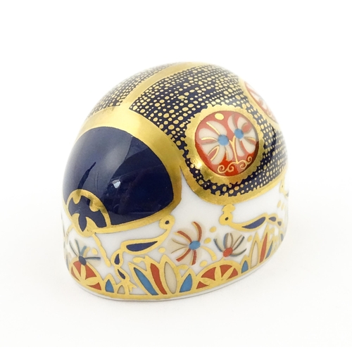 117 - A Royal Crown Derby paperweight modelled as a Blue Ladybird. Boxed. Approx. 1 1/2
