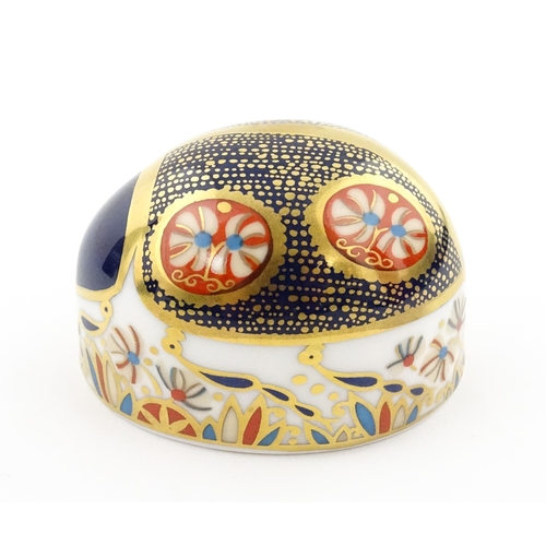 117 - A Royal Crown Derby paperweight modelled as a Blue Ladybird. Boxed. Approx. 1 1/2