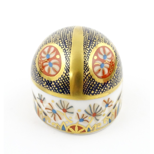 117 - A Royal Crown Derby paperweight modelled as a Blue Ladybird. Boxed. Approx. 1 1/2