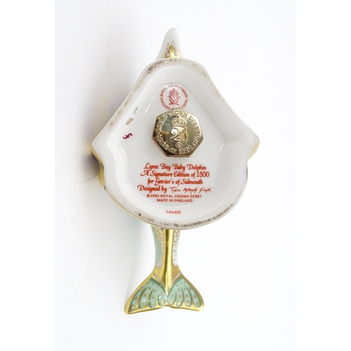 119 - A Royal Crown Derby paperweight modelled as a Lyme Bay Baby Dolphin. A signature edition of 1500 for... 