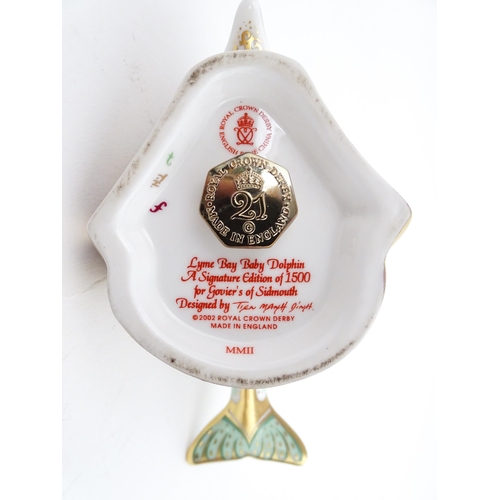 119 - A Royal Crown Derby paperweight modelled as a Lyme Bay Baby Dolphin. A signature edition of 1500 for... 