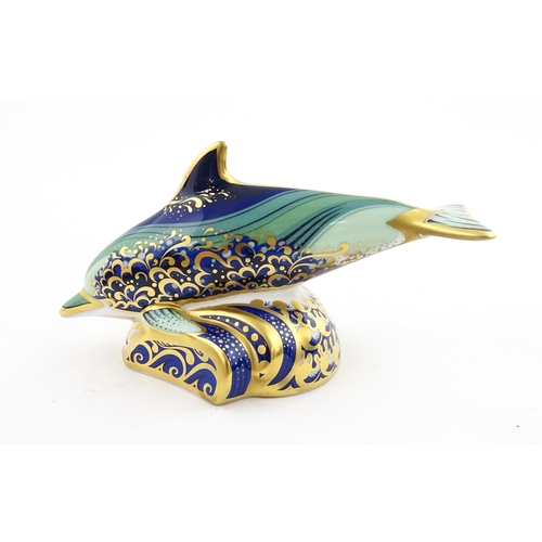 119 - A Royal Crown Derby paperweight modelled as a Lyme Bay Baby Dolphin. A signature edition of 1500 for... 
