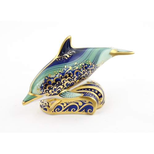 119 - A Royal Crown Derby paperweight modelled as a Lyme Bay Baby Dolphin. A signature edition of 1500 for... 