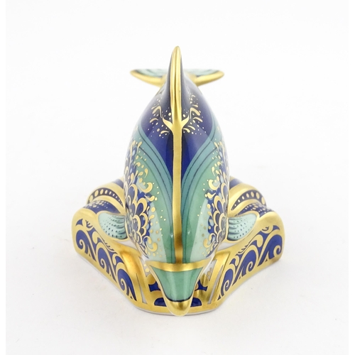 119 - A Royal Crown Derby paperweight modelled as a Lyme Bay Baby Dolphin. A signature edition of 1500 for... 