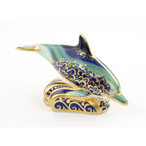 119 - A Royal Crown Derby paperweight modelled as a Lyme Bay Baby Dolphin. A signature edition of 1500 for... 