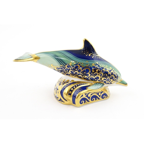 119 - A Royal Crown Derby paperweight modelled as a Lyme Bay Baby Dolphin. A signature edition of 1500 for... 