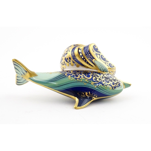 119 - A Royal Crown Derby paperweight modelled as a Lyme Bay Baby Dolphin. A signature edition of 1500 for... 