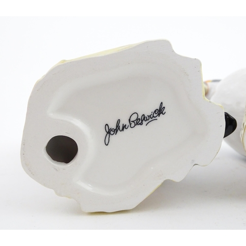 93 - Three John Beswick models of Puffins. Marked under. Approx. 4 1/4