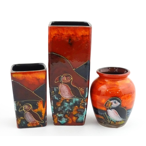 94 - Three Anita Harris studio pottery vases with Puffin decoration. Marked under, two marked Strowgers. ... 