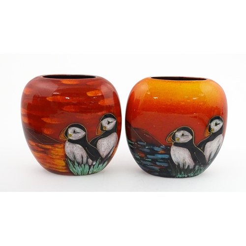 95 - A pair of Anita Harris studio pottery vases with Puffin decoration. Marked under, one marked Trial. ... 
