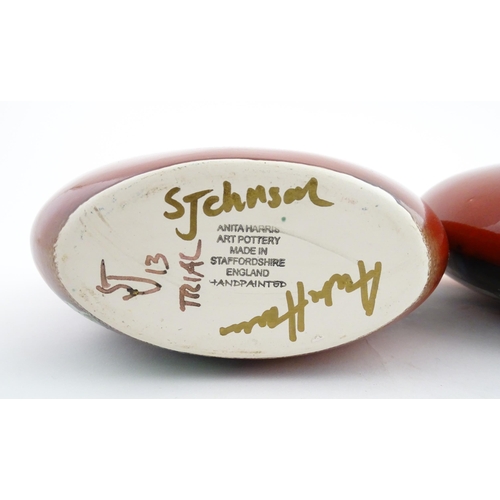 95 - A pair of Anita Harris studio pottery vases with Puffin decoration. Marked under, one marked Trial. ... 