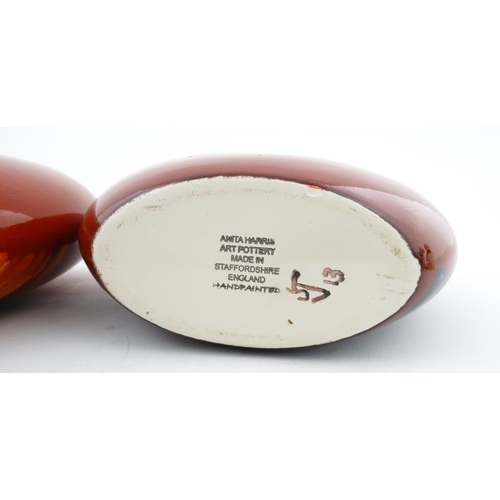 95 - A pair of Anita Harris studio pottery vases with Puffin decoration. Marked under, one marked Trial. ... 