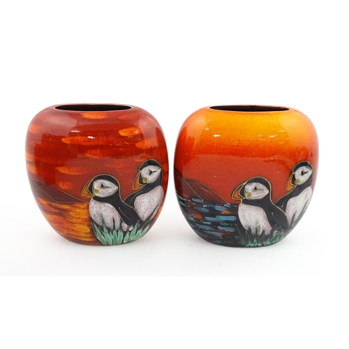 95 - A pair of Anita Harris studio pottery vases with Puffin decoration. Marked under, one marked Trial. ... 