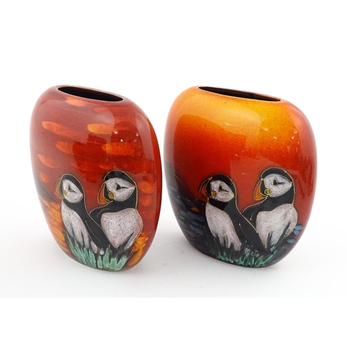 95 - A pair of Anita Harris studio pottery vases with Puffin decoration. Marked under, one marked Trial. ... 