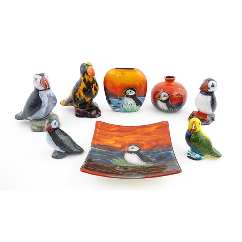 96 - A collection of Anita Harris studio pottery items to include vases and a dish with Puffin decoration... 