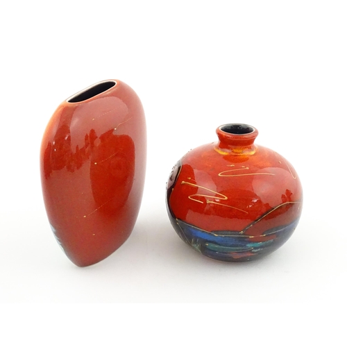 96 - A collection of Anita Harris studio pottery items to include vases and a dish with Puffin decoration... 