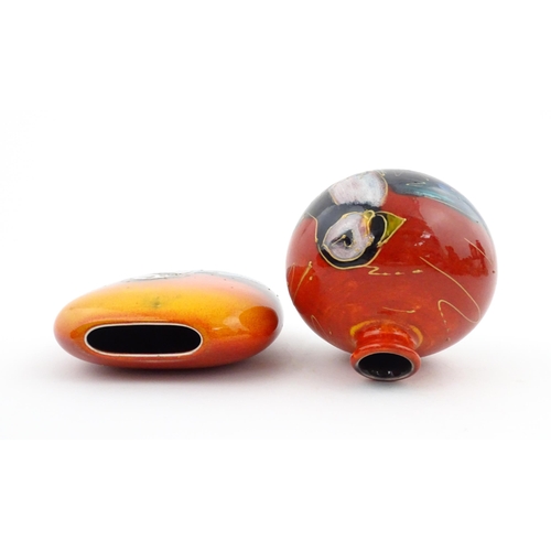 96 - A collection of Anita Harris studio pottery items to include vases and a dish with Puffin decoration... 