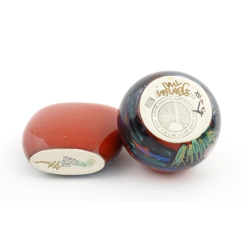 96 - A collection of Anita Harris studio pottery items to include vases and a dish with Puffin decoration... 