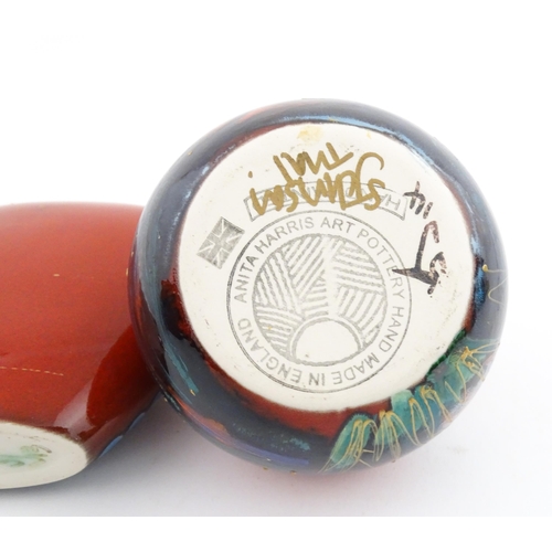 96 - A collection of Anita Harris studio pottery items to include vases and a dish with Puffin decoration... 