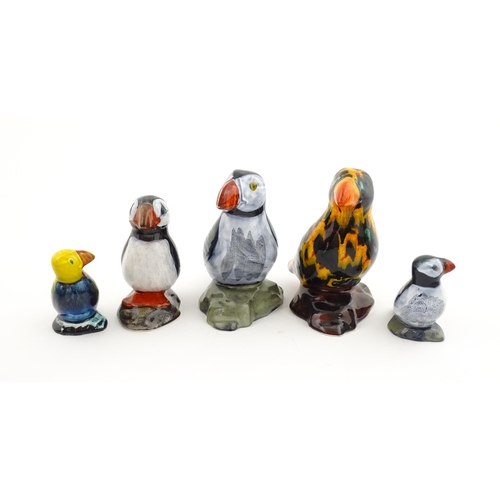 96 - A collection of Anita Harris studio pottery items to include vases and a dish with Puffin decoration... 