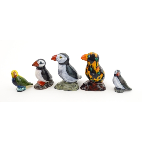 96 - A collection of Anita Harris studio pottery items to include vases and a dish with Puffin decoration... 