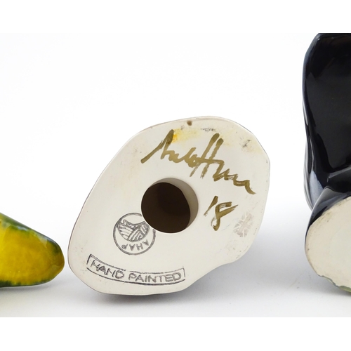 96 - A collection of Anita Harris studio pottery items to include vases and a dish with Puffin decoration... 