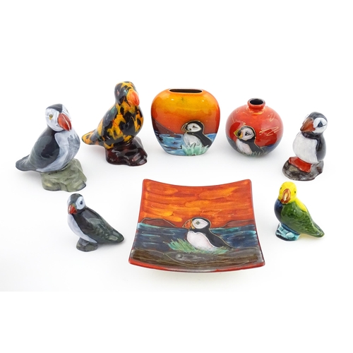 96 - A collection of Anita Harris studio pottery items to include vases and a dish with Puffin decoration... 