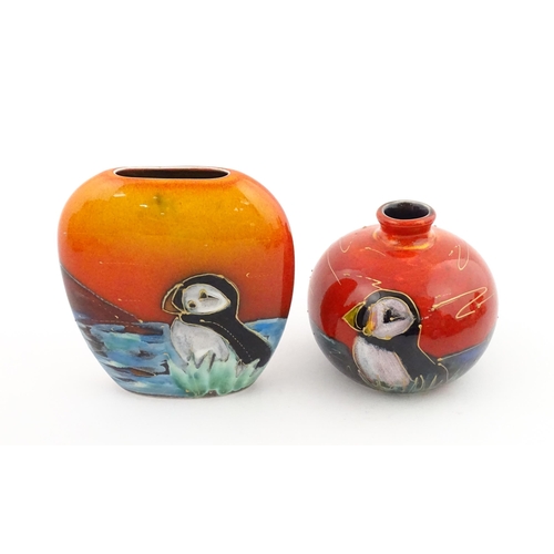 96 - A collection of Anita Harris studio pottery items to include vases and a dish with Puffin decoration... 