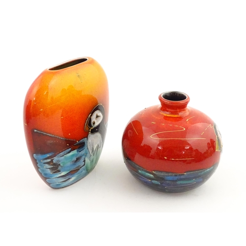96 - A collection of Anita Harris studio pottery items to include vases and a dish with Puffin decoration... 