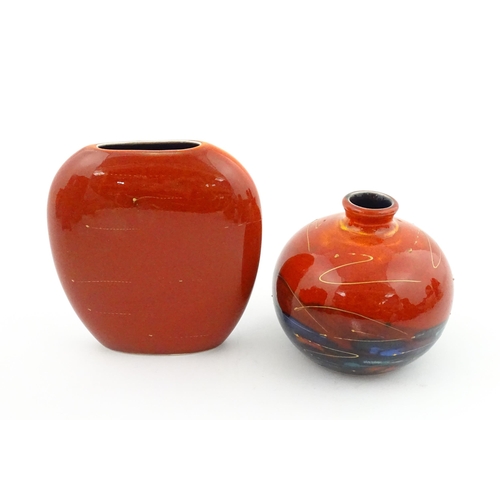 96 - A collection of Anita Harris studio pottery items to include vases and a dish with Puffin decoration... 