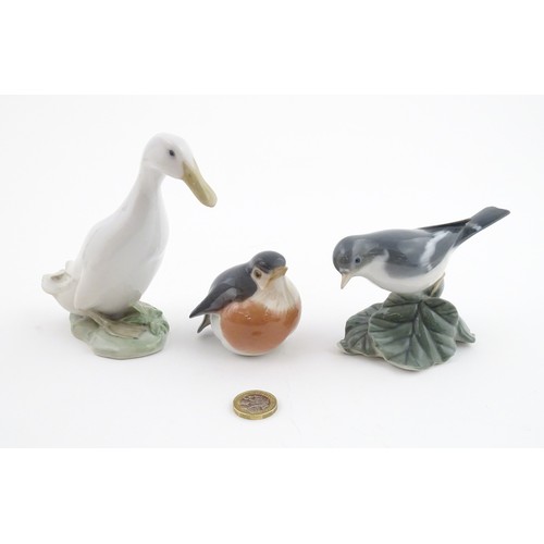 62 - Three Royal Copenhagen models of birds comprising a Duck no. 2122, Robin no. 2266, and Flycatcher no... 