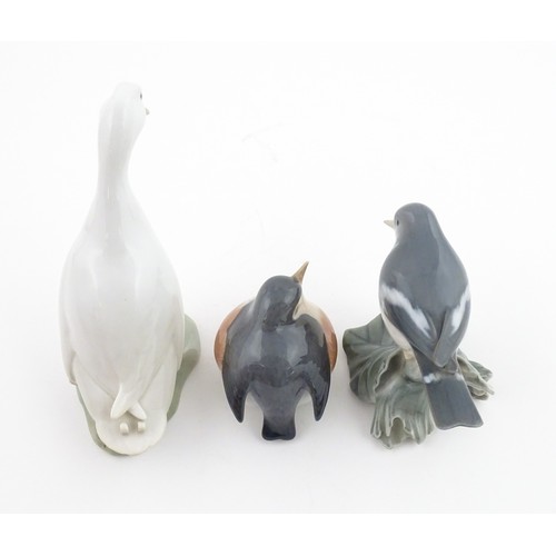 62 - Three Royal Copenhagen models of birds comprising a Duck no. 2122, Robin no. 2266, and Flycatcher no... 