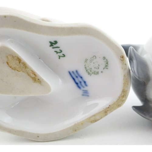 62 - Three Royal Copenhagen models of birds comprising a Duck no. 2122, Robin no. 2266, and Flycatcher no... 