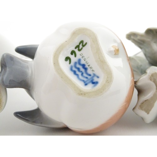 62 - Three Royal Copenhagen models of birds comprising a Duck no. 2122, Robin no. 2266, and Flycatcher no... 