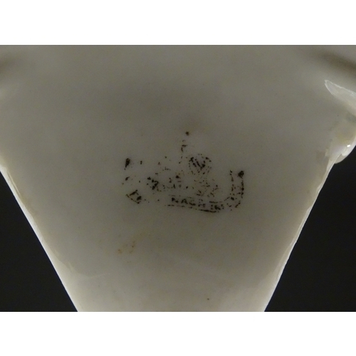 79 - A pair of Belleek Thistle vases with lustre detail. Marked with Second Period mark under. Approx. 10... 