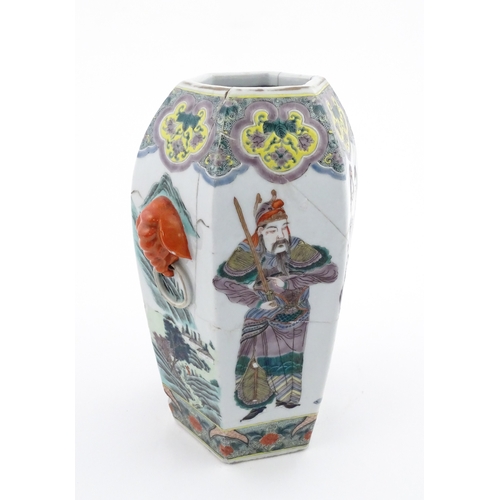 7 - A Chinese famille rose vase of hexagonal form with twin handles, decorated with male and female figu... 