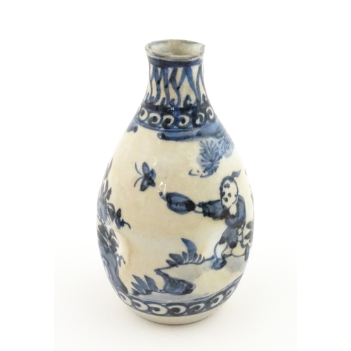 21A - A Chinese blue and white bottle vase with pinch detail decorated with a figure in a landscape. Toget... 