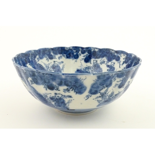 21A - A Chinese blue and white bottle vase with pinch detail decorated with a figure in a landscape. Toget... 