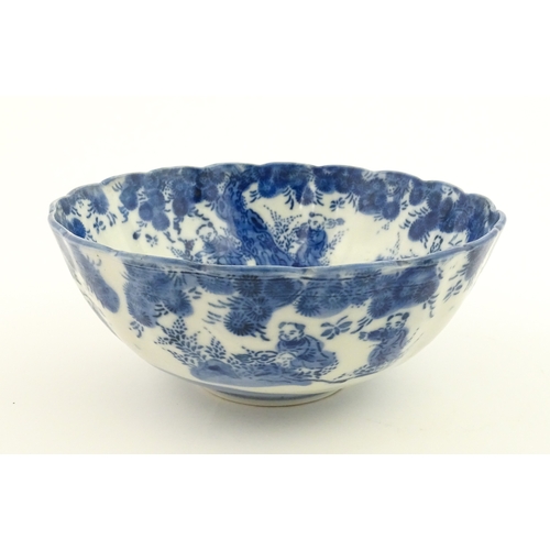 21A - A Chinese blue and white bottle vase with pinch detail decorated with a figure in a landscape. Toget... 