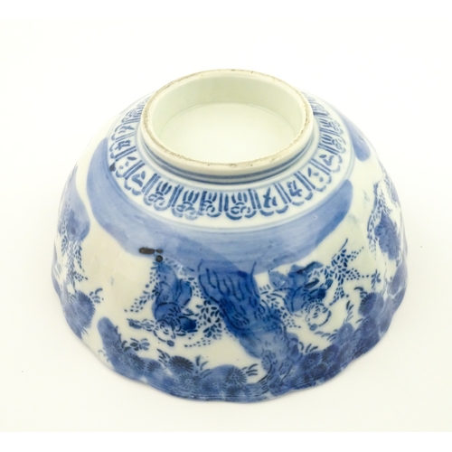 21A - A Chinese blue and white bottle vase with pinch detail decorated with a figure in a landscape. Toget... 