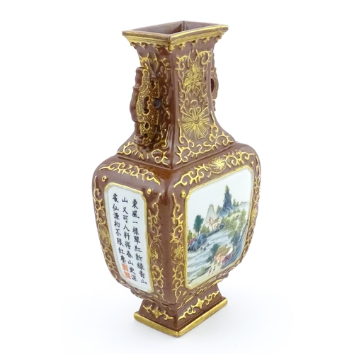 23 - A Chinese famille rose vase with brown ground and gilt highlights, decorated with landscapes and Cha... 