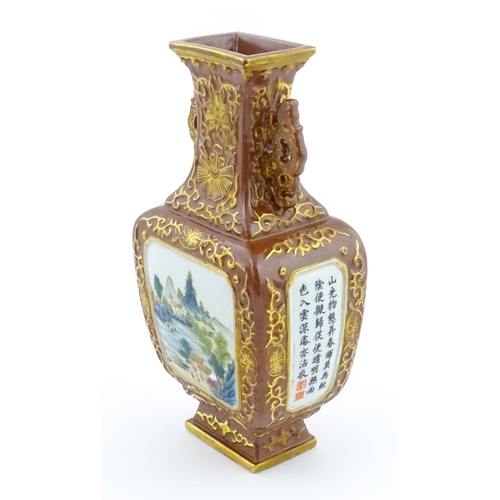23 - A Chinese famille rose vase with brown ground and gilt highlights, decorated with landscapes and Cha... 
