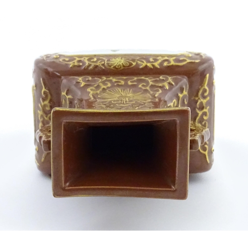 23 - A Chinese famille rose vase with brown ground and gilt highlights, decorated with landscapes and Cha... 