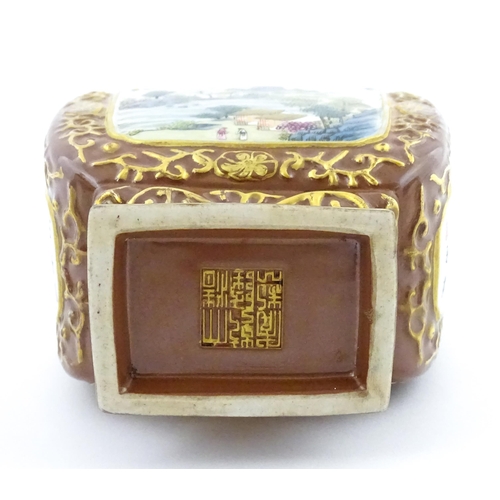 23 - A Chinese famille rose vase with brown ground and gilt highlights, decorated with landscapes and Cha... 