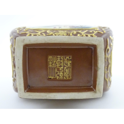 23 - A Chinese famille rose vase with brown ground and gilt highlights, decorated with landscapes and Cha... 